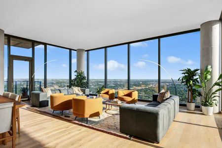 Spacious living area with a peek of the private balcony.