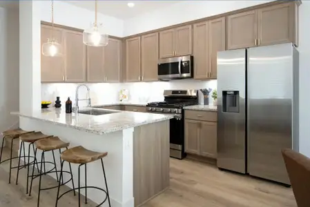 Open concept kitchen with bar seating is great for entertaining