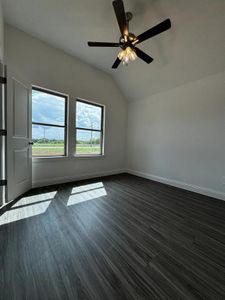 Bonus room with ceiling fan and lofted ceiling