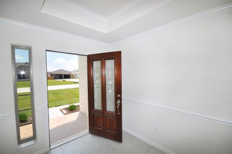 Bright and Cheerful entry for friends and family. Entry door is a triple pane etched glass on a solid wood door.