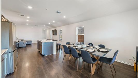 Dining area with sink and dark hardwood / wood-style flooring