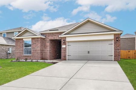 Ranch-style home with a garage and a front yard