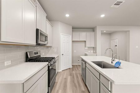 This kitchen is not only a functional space but also has ample storage. Whether you're a seasoned chef or just love to gather and enjoy good food, this kitchen is a dream come true.