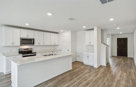 Airy kitchen with ample cabinet space*real home pictured