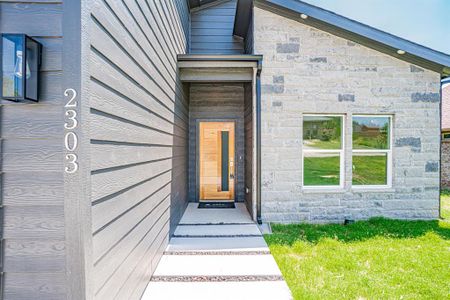 Front entry of new construction contemporary style home