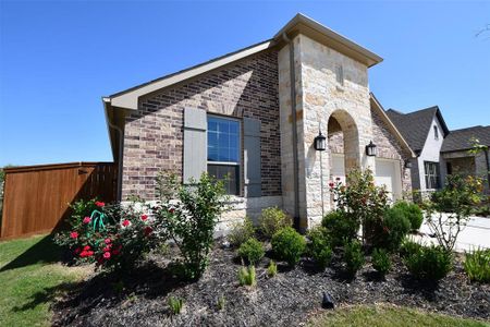 This is a charming single-story home with a brick and stone exterior. It features a two-car garage, a well-maintained front yard, and a welcoming entrance. The neighborhood appears to be quiet and residential. This is a charming single-story home with a brick and stone exterior. It features a two-car garage, a well-maintained front yard, and a welcoming entrance. The neighborhood appears to be quiet and residential.
