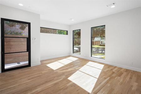 Unfurnished room with light wood-type flooring