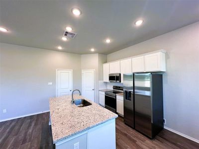 Stainless Steel Appliances, granite counters, ceramic tile backsplash & 42" upper cabinets!