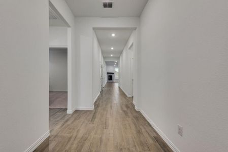 Hallway featuring hardwood / wood-style flooring