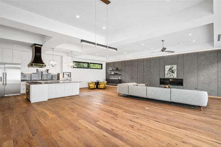 Open concept living room dining room.  Behind the gray wall is the massive mother in law suite or could be used as the first floor primary suite.