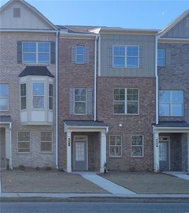 New construction Townhouse house 581 Fundao Lane, Unit 12, Lawrenceville, GA 30046 - photo 0