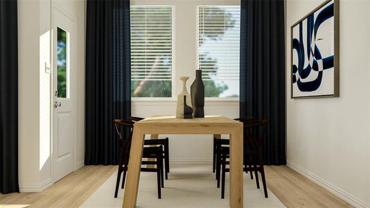 Dining space with light hardwood / wood-style floors