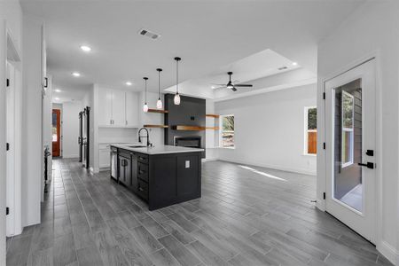 Open kitchen and living room with fireplace