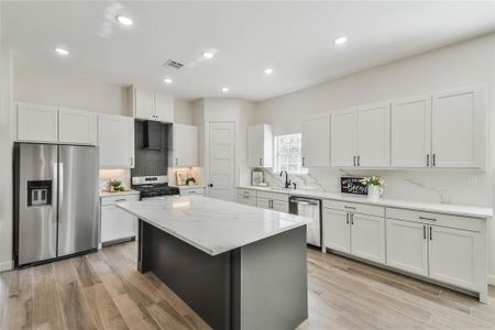 Large kitchen island that easily sits 4 and look at all the cabinet space!