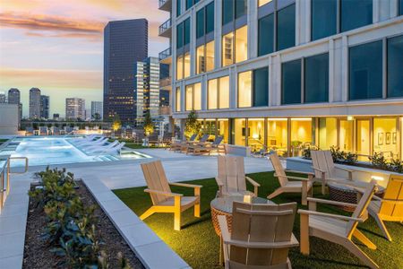 Cabanas, lounge chairs and turf areas run throughout the massive pool deck level.