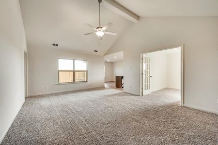 beamed ceiling, ceiling fan, high vaulted ceiling, and light carpet