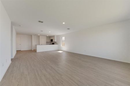 Unfurnished living room with light wood-type flooring