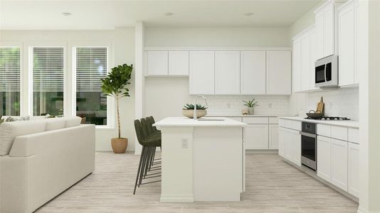 Kitchen with appliances with stainless steel finishes, plenty of natural light, a center island, and white cabinets