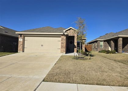 Ranch-style home featuring a garage