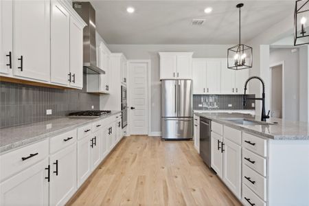 Beautiful, sleek cabinets with black iron hardware.