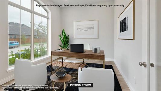 Office area with hardwood / wood-style floors