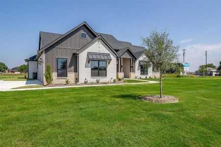 View of front of property with a front lawn