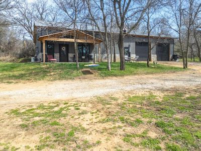 View of yard with an outdoor structure