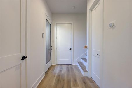 Entry foyer. Home comes with a security system pre-installed, with a keypad by the front door.