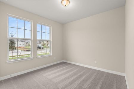 Your secondary bedroom features plush carpet, fresh paint, closet, and a large window that lets in plenty of natural lighting.