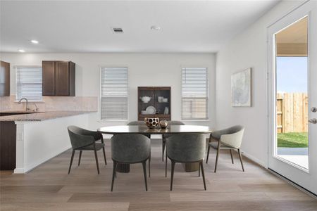 Gather the family and guests together in your lovely living room! Featuring high ceilings, recessed lighting, custom paint, gorgeous floors and large windows that provide plenty of natural lighting throughout the day.