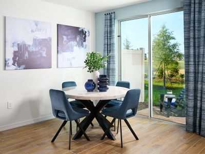 Dining room in the Oakville floorplan modeled at Cagan Crossings West