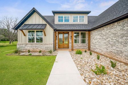 Property entrance featuring a lawn