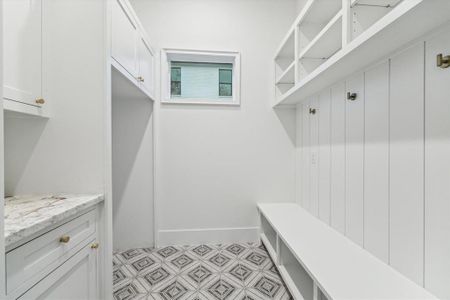 Mud room with custom built-ins for backpacks, second refrigerator and whatever you want to store