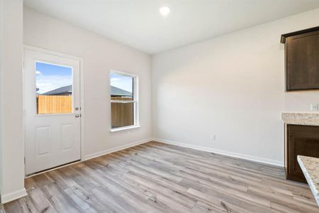 Unfurnished living room with light hardwood / wood-style floors