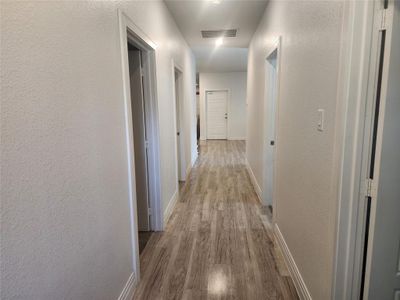 Corridor featuring light hardwood / wood-style floors