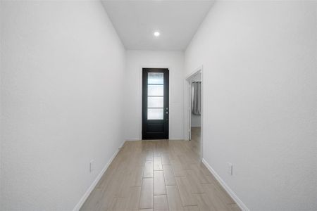 This home features wide hallways that enhance the sense of space and flow, creating an open and inviting atmosphere.