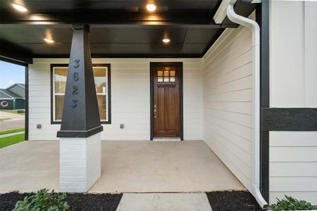 Entrance to property featuring a porch