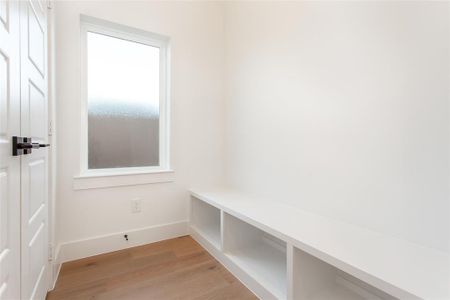 Mudroom featuring hardwood / wood-style floors and plenty of natural light