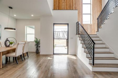 Entrance foyer featuring stairs, recessed lighting, wood finished floors, and baseboards