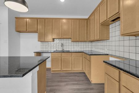 Beautifully Styled Kitchen w/ Sleek Quartz Countertops and Ceramic Tile Backsplash