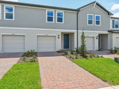 New construction Townhouse house 16394 Bird Of Paradise Ave, Clermont, FL 34714 Calistoga I- photo 0