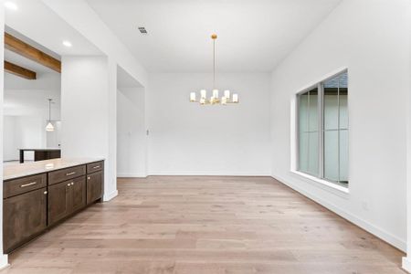 Formal Dining with Built-in Cabinet and Engineered Hardwood Flooring.