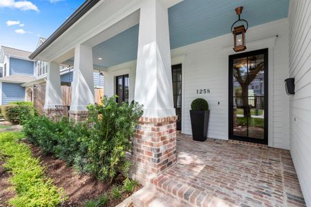 Home offers a deep brick front porch w/ swing, 2 sets of French doors leading to the Study & Steel/Glass Front Entry Door w/ gas lantern.