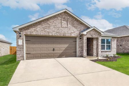 View of front of property featuring a garage and a front lawn