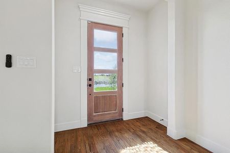 Doorway featuring dark hardwood / wood-style floors