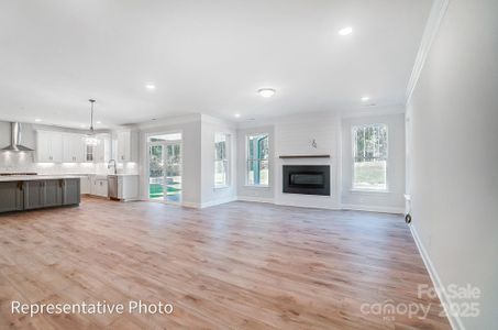 Spacious Family Room with Cosmo Fireplace and shiplap wall