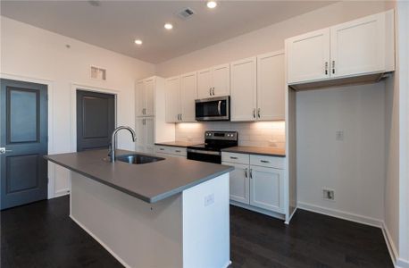 Quartz countertops paired with 42" soft close cabinets and hardwoods throughout *Home is Under Construction. Photos shown are from other TPG Communities to display how the home will live*