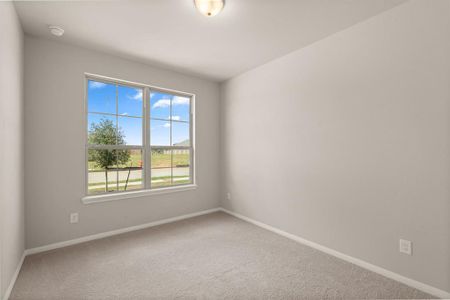 Your secondary bedroom features plush carpet, fresh paint, closet, and a large window that lets in plenty of natural lighting.