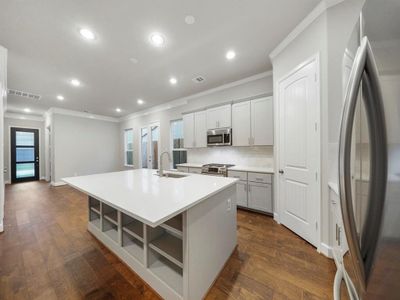 Ample counter top space. Extensive lower and upper custom cabinets for all of your cooking essentials. (Sample photo of a completed Sterling Floor Plan. Image may show alternative features/and or upgrades.)