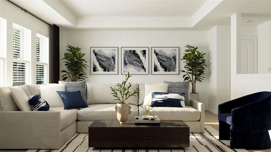 Carpeted living room featuring a raised ceiling